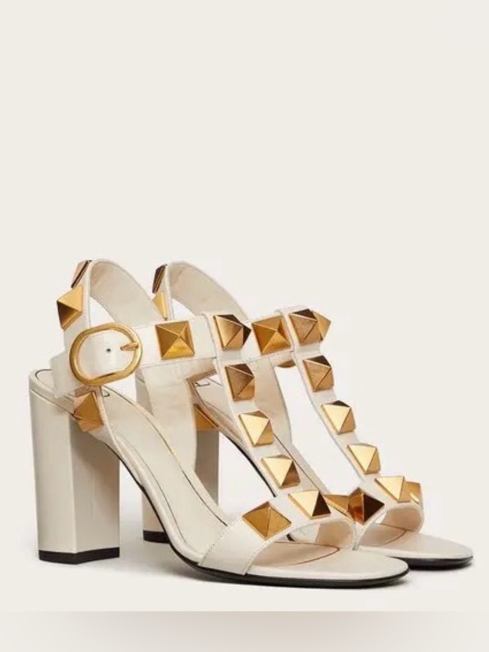 Valentino Garavani White Leather T-Strap Sandals with Gold Pyramid Studs